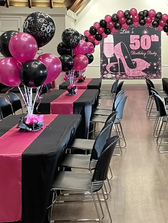 50th birthday party celebration with black and red balloons