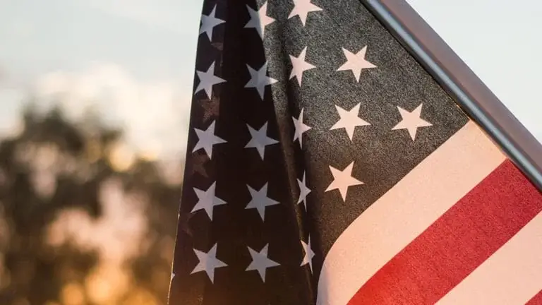 United States flag flying outdoors.