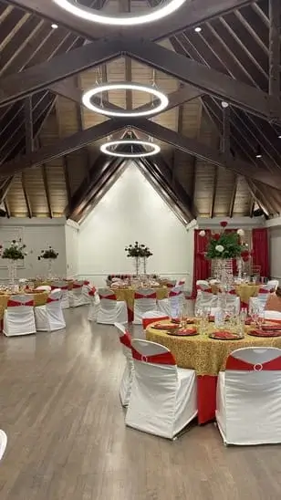 Hall rental wedding reception with red and gold theme.