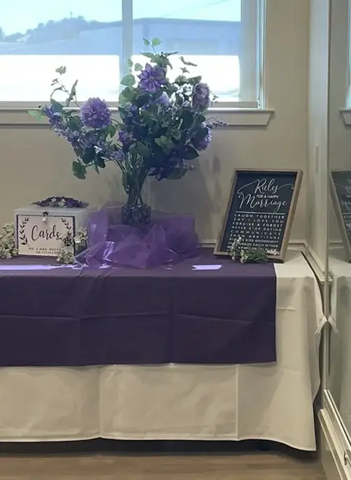 Wedding reception with purple decorations at Vacaville Veterans Hall.